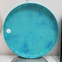 Back of the turquoise 1957 Space Saucer showing its circular form and molded underside.